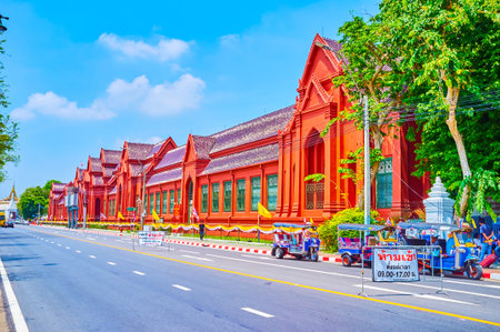 BANGKOK, THAILAND - APRIL 23, 2019: The red walls of Thawornwatthu Building (Tuek Daeng), the historical funeral building, buildt King Rama V, nowadays serves as King Chulalongkorn Memorial Library, on April 23 in Bangkok, Thailandのeditorial素材