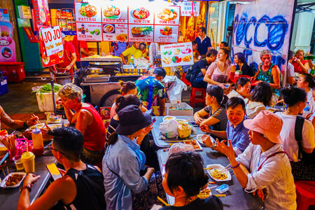 BANGKOK, THAILAND - APRIL 23, 2019: The busy outdoor cafe on Khaosan Road offer variety of Thai food...