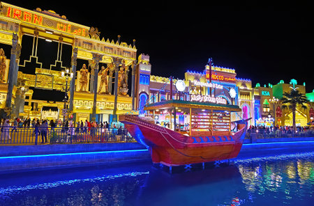 DUBAI, UAE - MARCH 6, 2020: The stall, shaped as the vintage style dhow boat, moored at the bank of the canal in front of Iran Pavilion of Global Village Dubai, on March 6 in Dubaiのeditorial素材