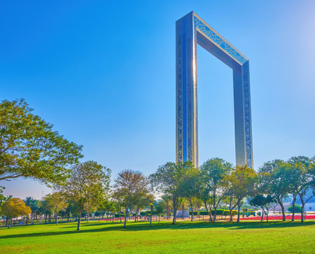 DUBAI, UAE - MARCH 6, 2020: Futuristic glass Dubai Frame, decorated with aluminium patterns, seen from green Zabeel Park, on March 6 in Dubaiのeditorial素材