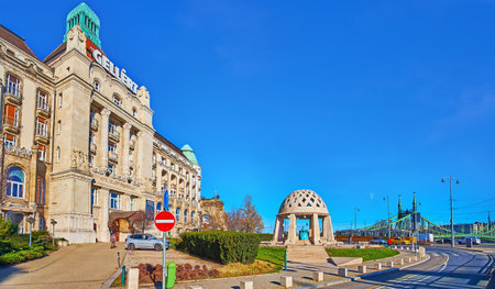 Panorama with the scenic stone Source House on Gellert Square with Gellert Hotel and Liberty Bridge in background, Budapest, Hungaryのeditorial素材
