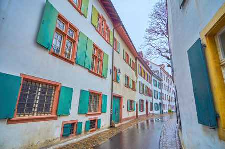 Twisted narrow Martinsgasse street with Basels's  oldtraditional residential houses, Switzerlandの写真素材