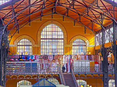 BUDAPEST, HUNGARY - FEB 22, 2022: The upper gallery of Central Market Hall with souvenir stalls and...