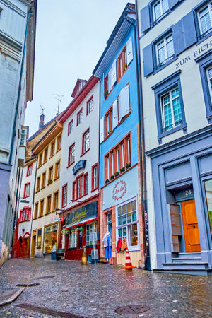 BASEL, SWITZERLAND - APRIL 1, 2022: The narrow Gerbergasslein street with scenic and dense historical houses in the heart of old town, on April 1 in Basel, Switzerlandのeditorial素材