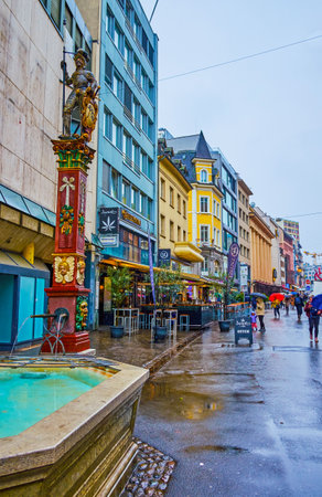 BASEL, SWITZERLAND - APRIL 1, 2022: The small Webernbrunnen fountain on Steinenvorstadt street, on April 1 in Basel, Switzerlandのeditorial素材