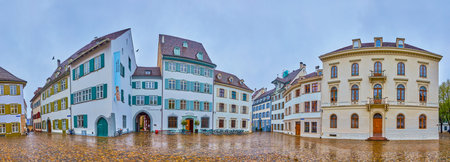 BASEL, SWITZERLAND - APRIL 1, 2022: Panoramic view on historical houses on Munsterplatz square, on April 1 in Basel, Switzerlandのeditorial素材