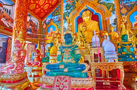 CHIANG MAI, THAILAND - MAY 3, 2019: Wat Thung Yu interior with different colored crystal images of...