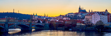 The view on Mala Strana's medieval landmarks on the hill and Vltava river on foreground, Prague, Czechiaの写真素材