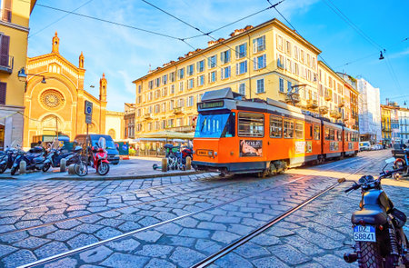 MILAN, ITALY - APRIL 11, 2022: Modern tram rides in Brera district, passing Piazza del Carmine, on April 11 in Milan, Italyのeditorial素材