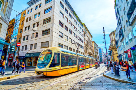 MILAN, ITALY - APRIL 11, 2022: Tram on Via Torino stree, one of the main shopping areas in central...
