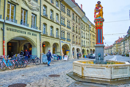 BERN, SWITZERLAND - MARCH 31, 2022: Simsonbrunnen fountain with sculpture of Samson on Kramgasse...