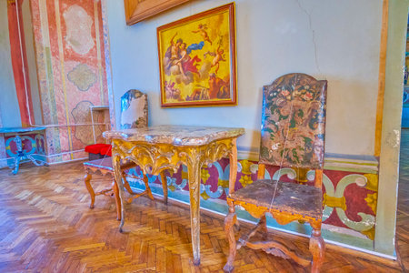 ZOLOCHIV, UKRAINE - JULY 28, 2021: Historic furniture in scenic interior of Olesko Castle, on July 28 in Zolochiv, Ukraineのeditorial素材