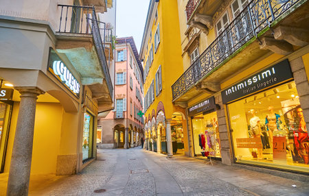 LUGANO, SWITZERLAND - MARCH 14, 2022: The  Via Pessina street of Lugano old town boasts many tourist shops and brand boutiques, Switzerlandのeditorial素材