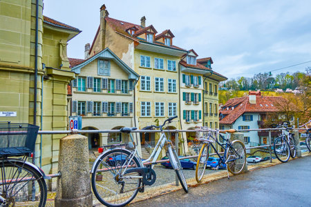 The bicycle parking along the railings of sidewalk of Nydeggtreppe staircases in Bern, Switzerlandのeditorial素材