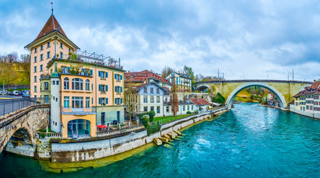 Panorama of Aare river with riverside medieval houses and arched bridges, Bern, Switzerland