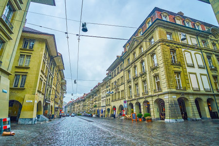 The stunning historic stone buildings in typical Bernese style with arcades on the ground floor,...