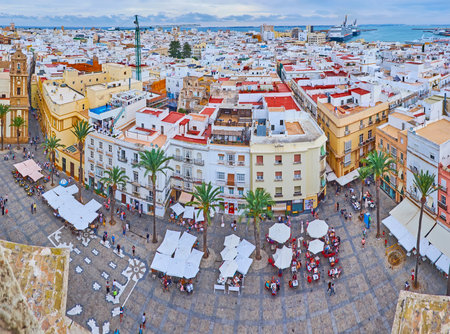 Panorama of the city from the bell tower of Cadiz Cathedral, observing cafes on Cathedral Square, edifices and roofs of old town, the coast and port with cruise liners in the background, Spainのeditorial素材