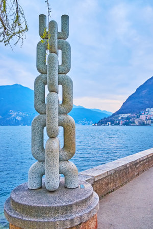 LUGANO, SWITZERLAND - MARCH 14, 2022: The Anchor Chain stone sculpture in Park of Sculptures on the bank of Lake Lugano, Lugano, Switzerlandのeditorial素材
