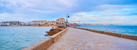 Panorama of the stone San Sebastian Castle levee against La Caleta beach, Cadiz, Costa de la Luz,...