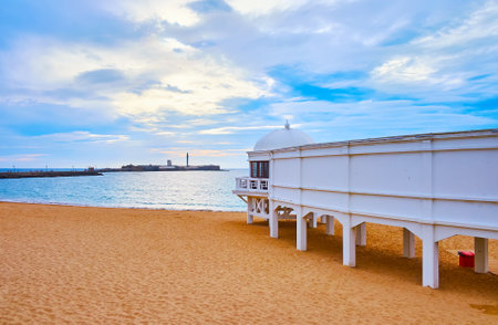 The white stilt building of the Underwater Archaeology Center Headquarters on the sand La Caleta beach, Cadiz, Spainのeditorial素材