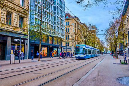 ZURICH, SWITZERLAND - APRIL 3, 2022: Bahnhofstrasse is the main downtown avenue and the home of luxury boutiques, on April 3 in Zurich, Switzerlandのeditorial素材