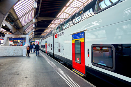ZURICH, SWITZERLAND - APRIL 3, 2022: The intercity train on the platform in Zurich railway station, on April 3 in Zurich, Switzerlandのeditorial素材