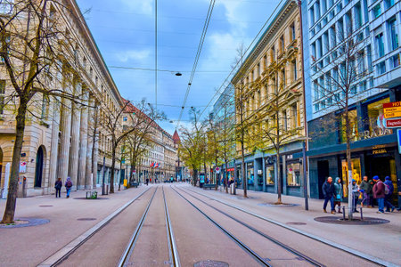 ZURICH, SWITZERLAND - APRIL 3, 2022: Famous Bahnhofstrasse, the main shopping street with luxury boutiques and stores, on April 3 in Zurich, Switzerlandのeditorial素材