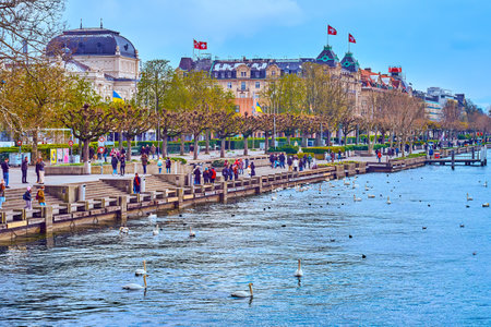 ZURICH, SWITZERLAND - APRIL 3, 2022: Quaianlagen recreation promenade on the shore of Lake Zurich, on April 3 in Zurich, Switzerlandのeditorial素材