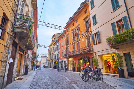CREMONA, ITALY - APRIL 6, 2022: Enjoy the shopping on Via Mercatello in the old town, Cremona, ...