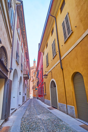 Old Via Janello Torriani with dense colored houses, Cremona, Italyの写真素材