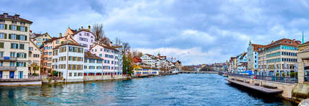 A panoramic view of downtown Zurich, encompassing both sides of the Limmat River, Switzerlandの写真素材