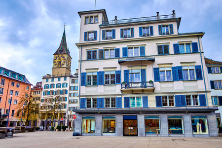 Weinplatz square with scenic old houses and the bell tower of Peterskirche above the roofs, Zurich, Switzerlandの写真素材