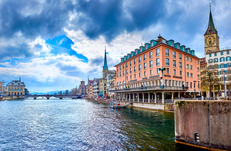 ZURICH, SWITZERLAND - APRIL 3, 2022: Great ensemble of the riverside houses with old Hotel Storchen, on April 3 in Zurich, Switzerlandのeditorial素材