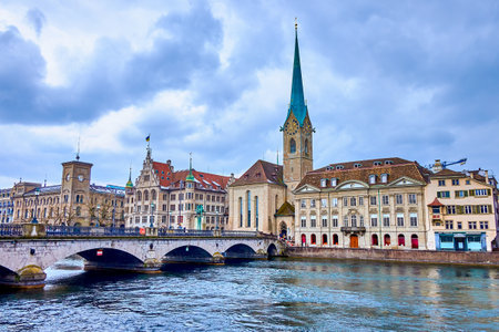 Picturesque view on Munsterbrucke bridge that spans the Limmat River and stunning Fraumunster church, Zurich, Switzerlandの写真素材