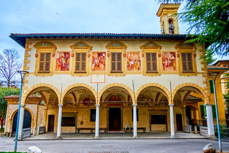 Arcaded facade of Santa Maria di Loreto Church with amazing frescoes, Lugano, Switzerland