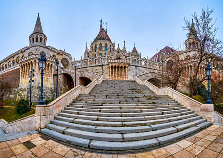 The staircase leading up to the intricately carved stone Fisherman's Bastion in Holy Trinity Square, Budapest, Hungary.の写真素材
