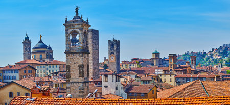 Panorama from Rocca di Bergamo park, observing red tile roofs of Citta Alta and medieval stone towers of city churches and palaces, Italyの写真素材