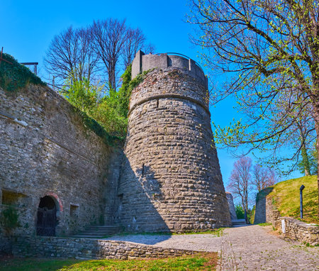 The medieval stone wall and tower of preserved San Vigilio Castle, Bergamo, Italyの写真素材