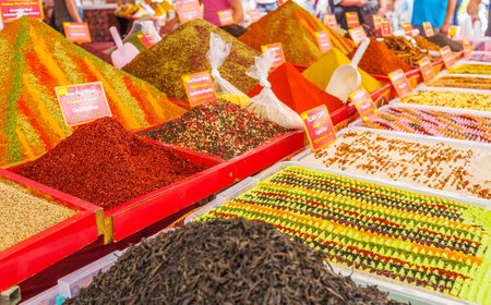 The counter of the stall with boxes of spices, dried herbs and fruit tea powders, Cumartesi Bazaar, Antalya, Turkeyの写真素材