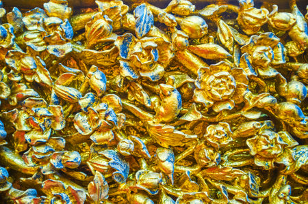 The golden carved decoration elements in Ordination Hall of Wat Suthat Temple in Bangkok, Thailandの写真素材