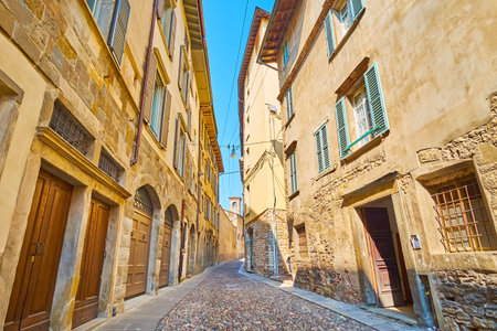 The medieval stone townhouses and Church of Santa Grata on Via Arena, Citta Alta, Bergamo, Italyの写真素材