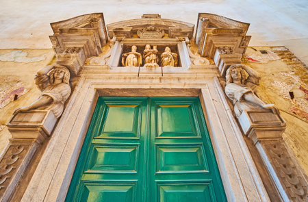 Ornate sculptured door frame of medieval Santa Grata Church, Via Arena, Bergamo, Italyの写真素材