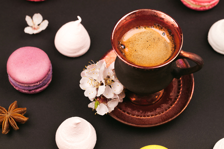 macaroons, marshmallow and coffee on black backgroundの写真素材