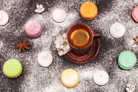 macaroons, marshmallow and coffee on black backgroundの写真素材