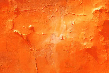 Cracked and textured red wall plaster backgroundの写真素材