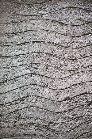 Gray concrete abstract background with waves scratchesの写真素材