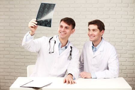 doctors discussions in the office filled with medical data of patient