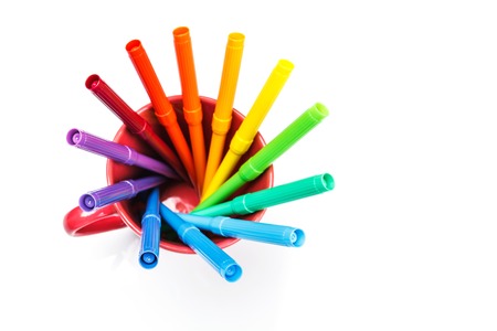 felt tip pens rainbow in cup on white backgroundの写真素材