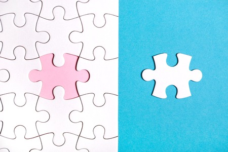 White puzzle with missing part on blue background. Business conceptの写真素材