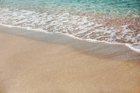 Transparent blue sea with golden sand. Concept of spending vacation in paradise.の写真素材